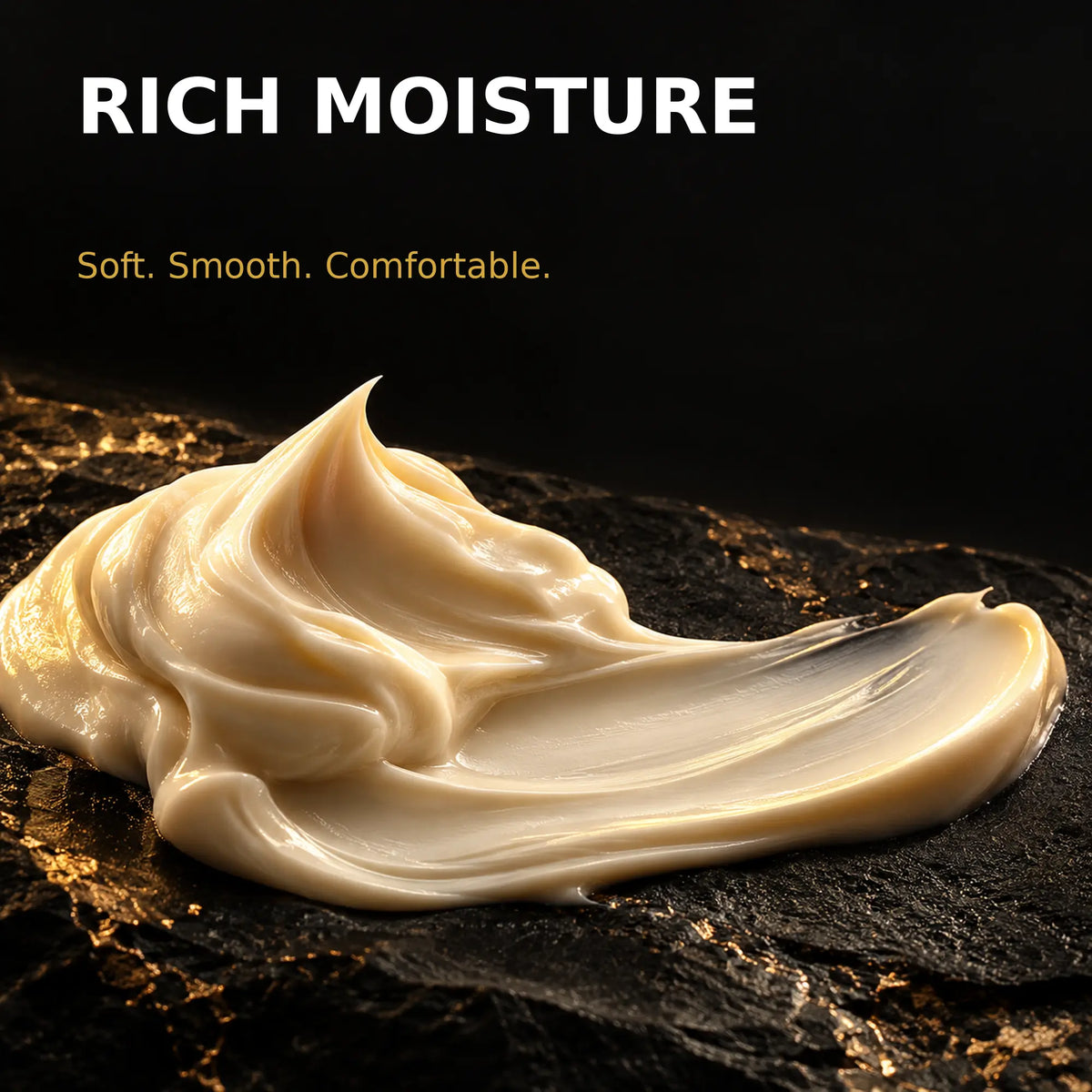 Rich moisturising hand cream texture on black and gold stone