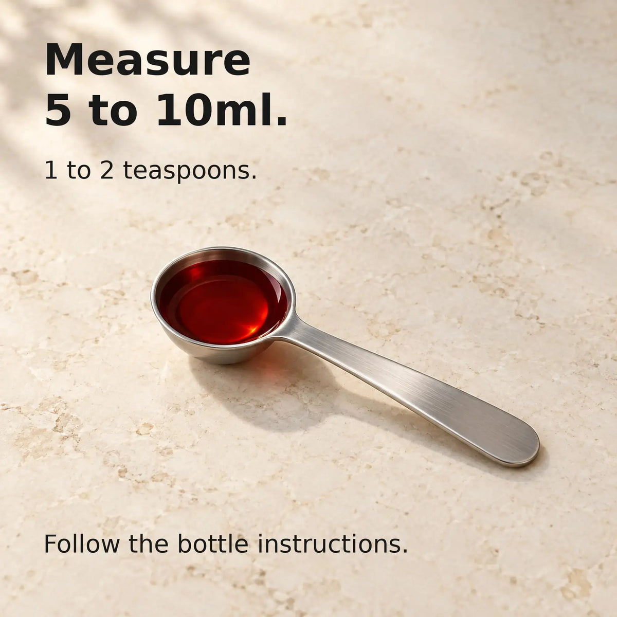 Measuring spoon illustrating the suggested 5 to 10ml amount for Gold Healing Colloidal Gold.