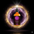 Bottle of Crown Chakra lavender frankincense spray with a cosmic background