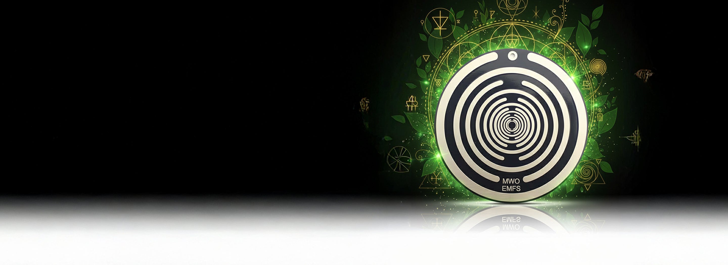 Tesla energy disc Hero Circular device with concentric circles and 'MWO EMFS' text, surrounded by green foliage and geometric symbols on a dark background.slider_item_LdLQAB