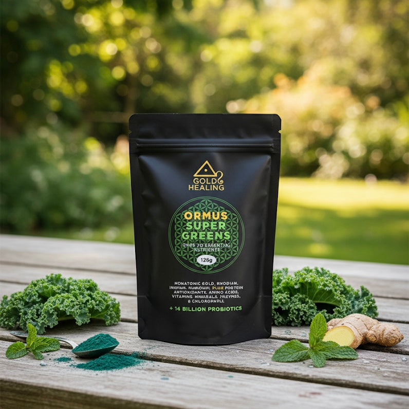 Gold Healing Ormus Super Greens package on a wooden surface with greenery in the background