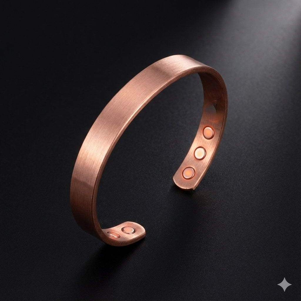 Copper bracelet with three round embellishments on a dark background