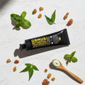 Ormus Fluoride free Botanical Toothpaste On table with botanical ingredients 