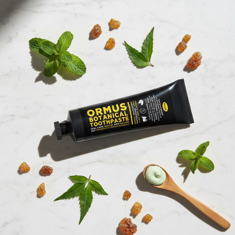 Ormus Fluoride free Botanical Toothpaste On table with botanical ingredients 
