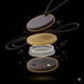 Energy pendant with gold, silver, and black components on a black background