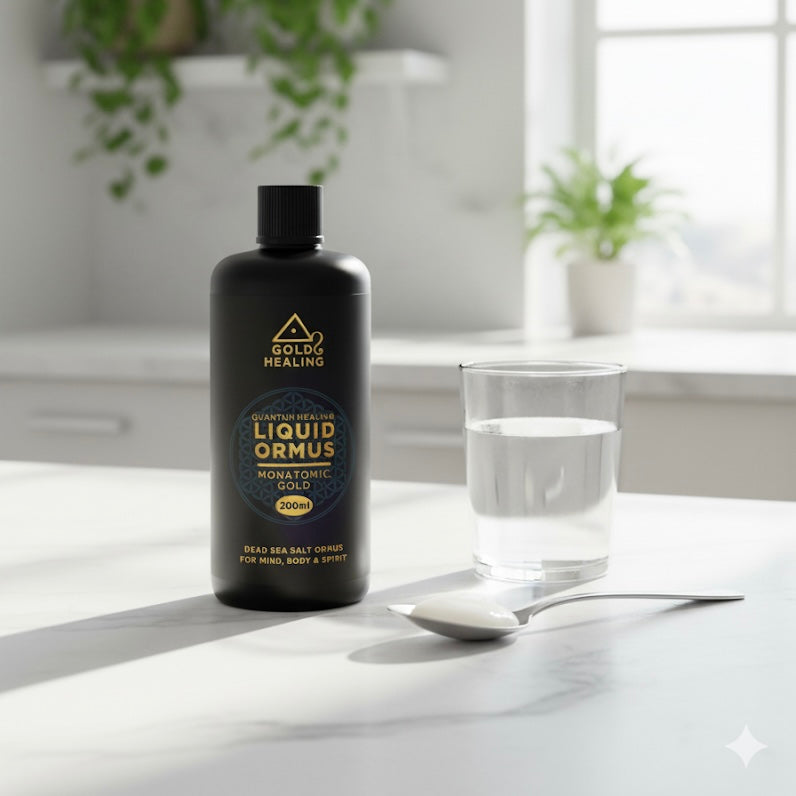Bottle of GoldHealing Liquid Ormus on a table with a glass of water and spoon.