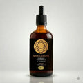 Bottle of 'Sacral Chakra' herbal tincture with a black label on a light gray background