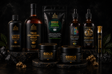 Gold Healing wellness product collection featuring liquid Ormus, colloidal gold, Ormus Super Greens, lucid dreaming tincture, mushroom blend, skincare creams, and monatomic gold vial on a dark luxury background.
