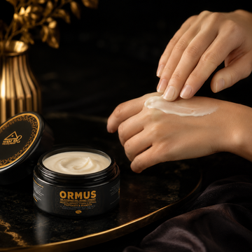 Woman applying Gold Healing ORMUS Rejuvenating Hand Cream to her hands